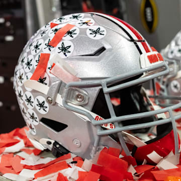 Jan 20, 2025; Atlanta, GA, USA; Detailed view of confetti with an Ohio State Buckeyes helmet after winning the CFP National Championship college football game at Mercedes-Benz Stadium. Mandatory Credit: Mark J. Rebilas-Imagn Images