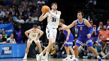 Mar 16, 2023; Sacramento, CA, USA;  Northwestern Wildcats forward Robbie Beran (31) controls the ball against Boise State Broncos forward Tyson Degenhart (2) in the first half at Golden 1 Center. Mandatory Credit: Kelley L Cox-Imagn Images
