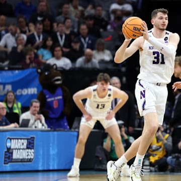 Mar 16, 2023; Sacramento, CA, USA;  Northwestern Wildcats forward Robbie Beran (31) controls the ball against Boise State Broncos forward Tyson Degenhart (2) in the first half at Golden 1 Center. Mandatory Credit: Kelley L Cox-Imagn Images