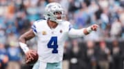 Dallas Cowboys quarterback Dak Prescott (4) communicates during the second half against the Carolina Panthers at Bank of America Stadium.