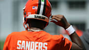 Cleveland Browns quarterback Shedeur Sanders (12) heads on to the field during day two of NFL rookie minicamp at the Cleveland Browns training facility on Saturday, May 10, 2025, in Berea, Ohio.