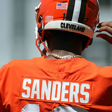Cleveland Browns quarterback Shedeur Sanders (12) heads on to the field during day two of NFL rookie minicamp at the Cleveland Browns training facility on Saturday, May 10, 2025, in Berea, Ohio.