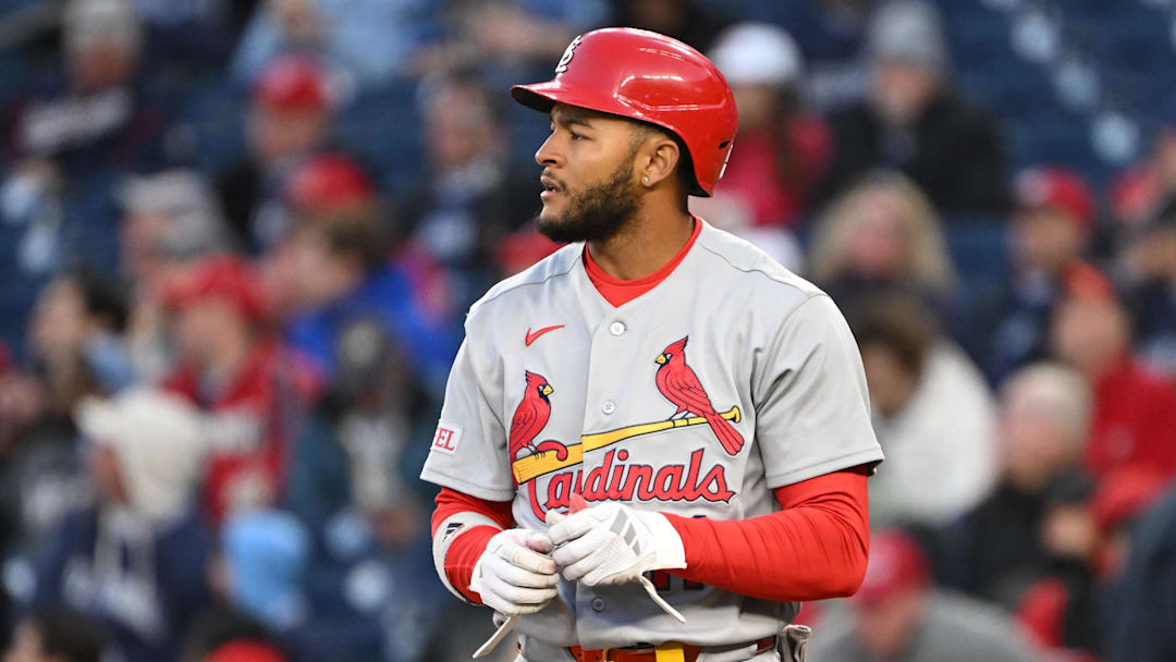 Apr 7, 2026; Washington, District of Columbia, USA; St. Louis Cardinals center fielder Victor Scott II (11) takes his batting gloves off after striking out against the Washington Nationals during the second inning at Nationals Park. Mandatory Credit: Rafael Suanes-Imagn Images