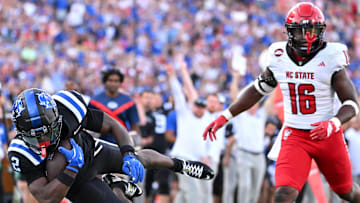 Sep 20, 2025; Durham, North Carolina, USA;  Duke Blue Devils linebacker Jaiden Francois (2) dives for a touchdown against North Carolina State Wolfpack saftey JJ Johnson (16) during the third quarter at Wallace Wade Stadium. Mandatory Credit: Zachary Taft-Imagn Images