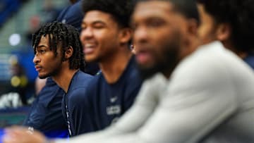 Feb 6, 2024; Hartford, Connecticut, USA; UConn Huskies guard Stephon Castle (5) watches from the sideline as his teammates warm up before the start of a game against the Butler Bulldogs.