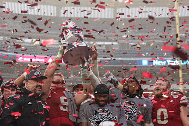 Nebraska Cornhuskers head coach Matt Rhule and players celebrate after the game against the Boston College Eagles.