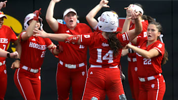 Indiana’s Sarah Stone (14) celebrates with her team after hitting a home run in the Big Ten softball tournament Friday, May 10, 2024 in Iowa City, Iowa.