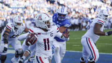 Oct 12, 2024; Provo, Utah, USA; Arizona Wildcats quarterback Noah Fifita (11) passes the ball from his own end zone against the Brigham Young Cougars during the fourth quarter at LaVell Edwards Stadium. Mandatory Credit: Rob Gray-Imagn Images