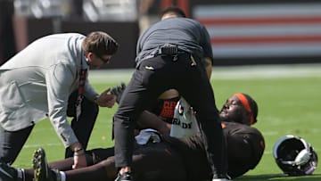 Sep 21, 2025; Cleveland, Ohio, USA; Cleveland Browns offensive tackle Dawand Jones (79) lies on the field after being injured against the Green Bay Packers during the first quarter at Huntington Bank Field. Mandatory Credit: Ken Blaze-Imagn Images