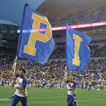 Oct 25, 2025; Pittsburgh, Pennsylvania, USA;  Pittsburgh Panthers cheerleaders celebrate a third quarter score against the North Carolina State Wolfpack at Acrisure Stadium. Mandatory Credit: Charles LeClaire-Imagn Images