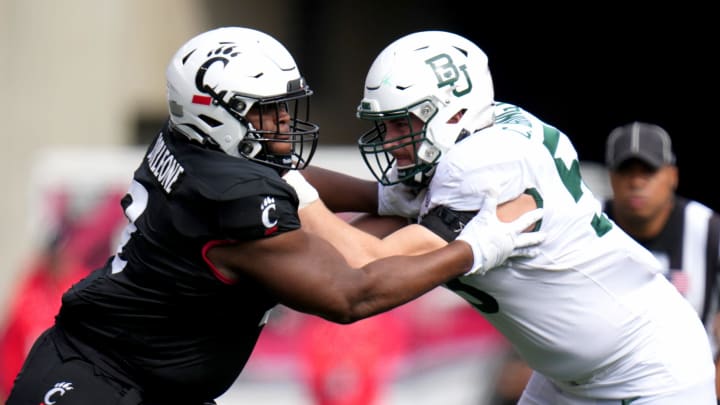 DUPLICATE***Cincinnati Bearcats wide receiver Dee Wiggins (2)***Cincinnati Bearcats defensive lineman Dontay Corleone (2) competes against Baylor Bears offensive lineman Campbell Barrington (53) in the first quarter during a college football game between the Baylor Bears and the Cincinnati Bearcats, Saturday, Oct. 21, 2023, at Nippert Stadium in Cincinnati.