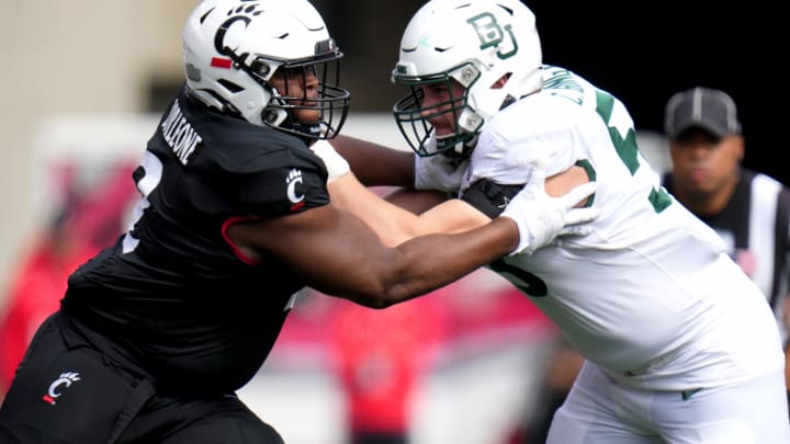 Oct 21, 2023; Cincinnati, Ohio, USA; Cincinnati Bearcats defensive lineman Dontay Corleone (2) rushes against Baylor Bears offensive lineman Campbell Barrington (53) in the first quarter at Nippert Stadium. Mandatory Credit: Kareem Elgazzar-USA TODAY Sports