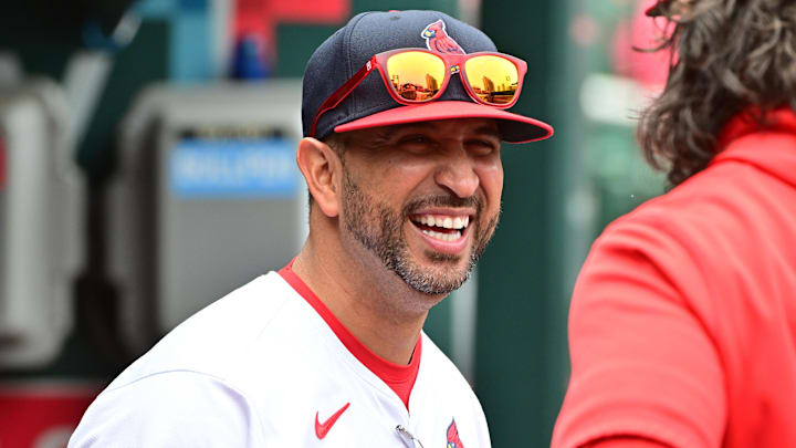 Jun 9, 2024; St. Louis, Missouri, USA; St. Louis Cardinals manager Oliver Marmol (37) shares a laugh in the dugout before the game against the Colorado Rockies at Busch Stadium. Mandatory Credit: Tim Vizer-USA TODAY Sports