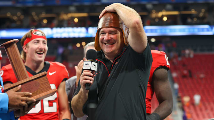 Aug 31, 2024; Atlanta, Georgia, USA; Georgia Bulldogs head coach Kirby Smart wears the old leather helmet after a victory over the Clemson Tigers at Mercedes-Benz Stadium. Mandatory Credit: Brett Davis-Imagn Images