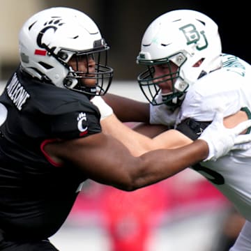 DUPLICATE***Cincinnati Bearcats wide receiver Dee Wiggins (2)***Cincinnati Bearcats defensive lineman Dontay Corleone (2) competes against Baylor Bears offensive lineman Campbell Barrington (53) in the first quarter during a college football game between the Baylor Bears and the Cincinnati Bearcats, Saturday, Oct. 21, 2023, at Nippert Stadium in Cincinnati.