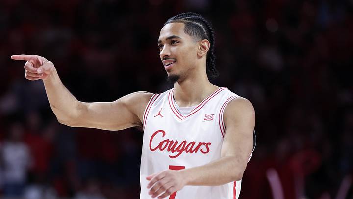 Feb 14, 2026; Houston, Texas, USA; Houston Cougars guard Milos Uzan (7) reacts while playing against the Kansas State Wildcats  in the first half at Fertitta Center. Mandatory Credit: Thomas Shea-Imagn Images