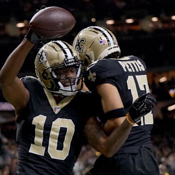 Dec 1, 2024; New Orleans, Louisiana, USA; New Orleans Saints wide receiver Marquez Valdes-Scantling (10) reacts with New Orleans Saints wide receiver Dante Pettis (17) after a touchdown against Los Angeles Rams cornerback Darious Williams (24) during the fourth quarter at Caesars Superdome. Mandatory Credit: Matthew Hinton-Imagn Images