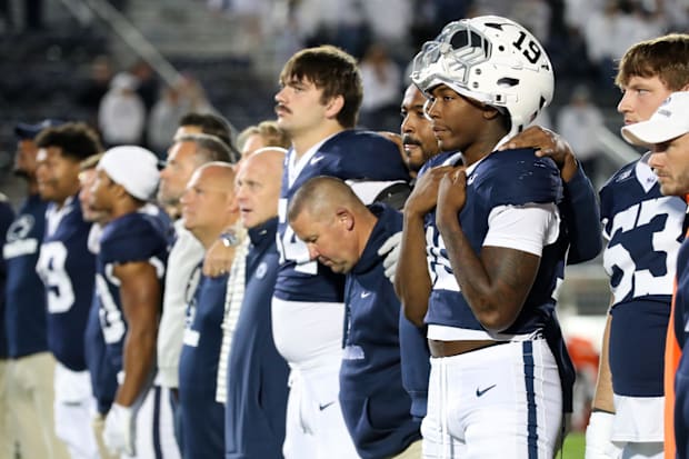 Penn State Nittany Lion players sing their alma mater