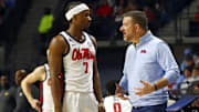 Jan 11, 2025; Oxford, Mississippi, USA; Mississippi Rebels head coach Chris Beard (right) talks with guard Davon Barnes (7) during the second half against the LSU Tigers at The Sandy and John Black Pavilion at Ole Miss. Mandatory Credit: Petre Thomas-Imagn Images