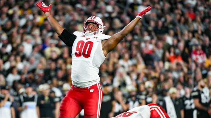 Sep 22, 2023; West Lafayette, Indiana, USA; Wisconsin Badgers defensive end James Thompson Jr. (90) celebrates after sacking Purdue Boilermakers quarterback Hudson Card (1) during the first half at Ross-Ade Stadium. Mandatory Credit: Robert Goddin-USA TODAY Sports