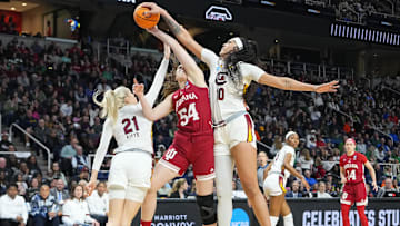 South Carolina basketball star Kamilla Cardoso blocking fellow All-American Mackenzie Holmes in the Sweet Sixteen of the NCAA Tournament.