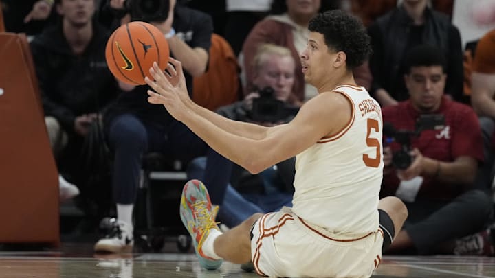 Feb 11, 2025; Austin, Texas, USA; Texas Longhorns forward Kadin Shedrick (5) passes the ball from the ground during the first half against the Alabama Crimson Tide at Moody Center.