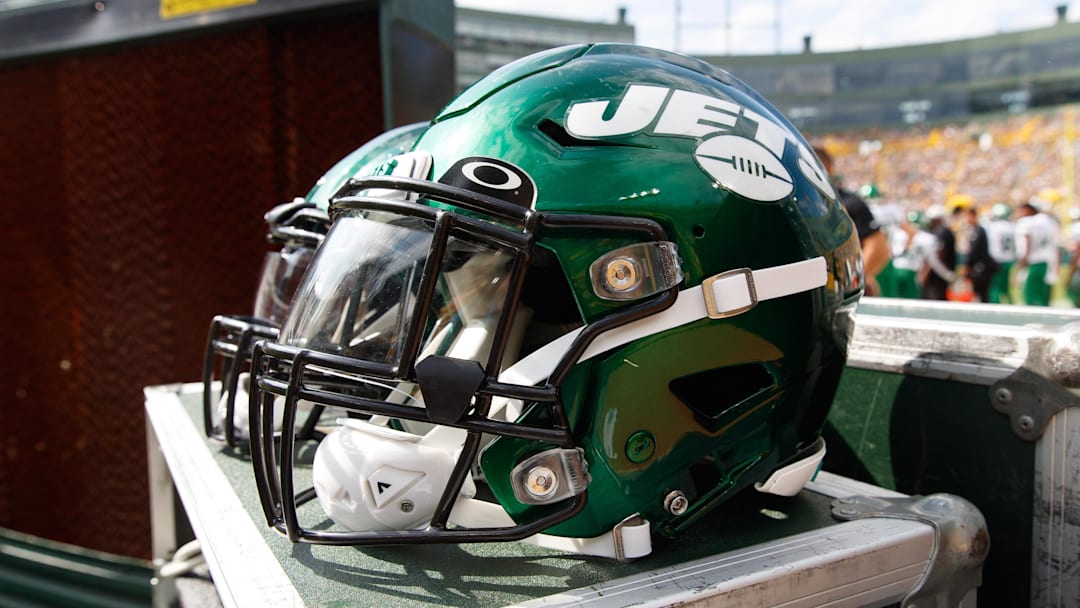 Aug 21, 2021; Green Bay, Wisconsin, USA;  New York Jets helmets sit on the sidelines during the game against the Green Bay Packers at Lambeau Field. Mandatory Credit: Jeff Hanisch-Imagn Images