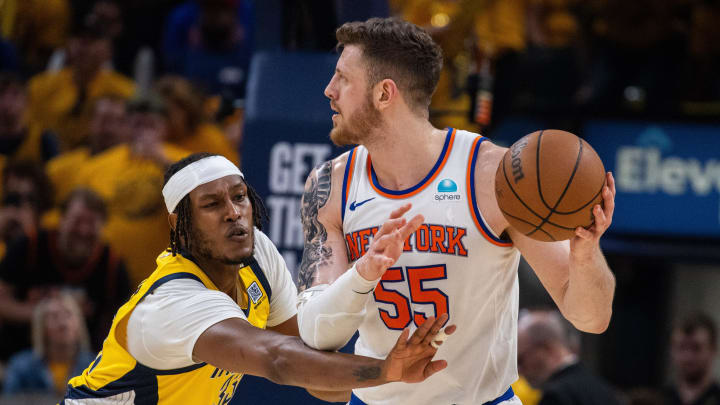 May 17, 2024; Indianapolis, Indiana, USA; New York Knicks center Isaiah Hartenstein (55) holds the ball while Indiana Pacers center Myles Turner (33) defends during game six of the second round for the 2024 NBA playoffs at Gainbridge Fieldhouse. Mandatory Credit: Trevor Ruszkowski-USA TODAY Sports