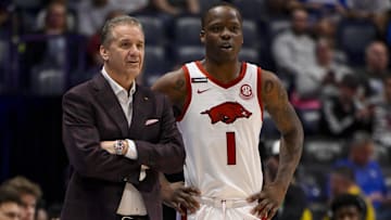 Mar 12, 2025; Nashville, TN, USA;  Arkansas Razorbacks head coach John Calipari talks with guard Johnell Davis (1) against the Arkansas Razorback during the first half at Bridgestone Arena. Mandatory Credit: Steve Roberts-Imagn Images