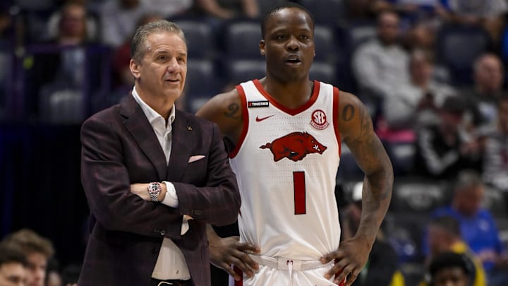 Mar 12, 2025; Nashville, TN, USA;  Arkansas Razorbacks head coach John Calipari talks with guard Johnell Davis (1) against the Arkansas Razorback during the first half at Bridgestone Arena. Mandatory Credit: Steve Roberts-Imagn Images