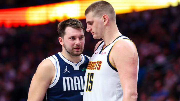 Mar 17, 2024; Dallas, Texas, USA;  Dallas Mavericks guard Luka Doncic (77) speaks with Denver Nuggets center Nikola Jokic (15) during the second half at American Airlines Center. Mandatory Credit: Kevin Jairaj-USA TODAY Sports