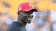 Tampa Bay Buccaneers head coach Todd Bowles warms up for a game against the Pittsburgh Steelers at Acrisure Stadium.