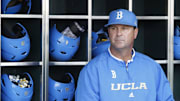 Jun 24, 2013; Omaha, NE, USA; UCLA Bruins head coach John Savage (22) looks on in the dugout before game 1 of the College World Series finals against the Mississippi State Bulldogs at TD Ameritrade Park. Mandatory Credit: Bruce Thorson-Imagn Images
