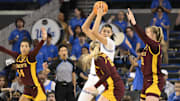 Feb 2, 2025; Los Angeles, California, USA; UCLA Bruins center Lauren Betts (center) is triple teamed on defense by Minnesota Golden Gophers guard Tori McKinney (14), Grace Grocholski (25) and center Sophie Hart (52) during the third quarter at Pauley Pavilion presented by Wescom. Mandatory Credit: Robert Hanashiro-Imagn Images