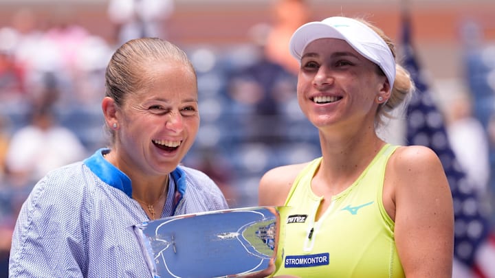 Sept 6, 2024; Flushing, NY, USA; Lyudmyla Kichenok (UKR) (right)  and Jelena Ostapenko (LAT) with the US Open trophy after winning the Women's Doubles final on day twelve of the 2024 U.S. Open tennis tournament at USTA Billie Jean King National Tennis Center.