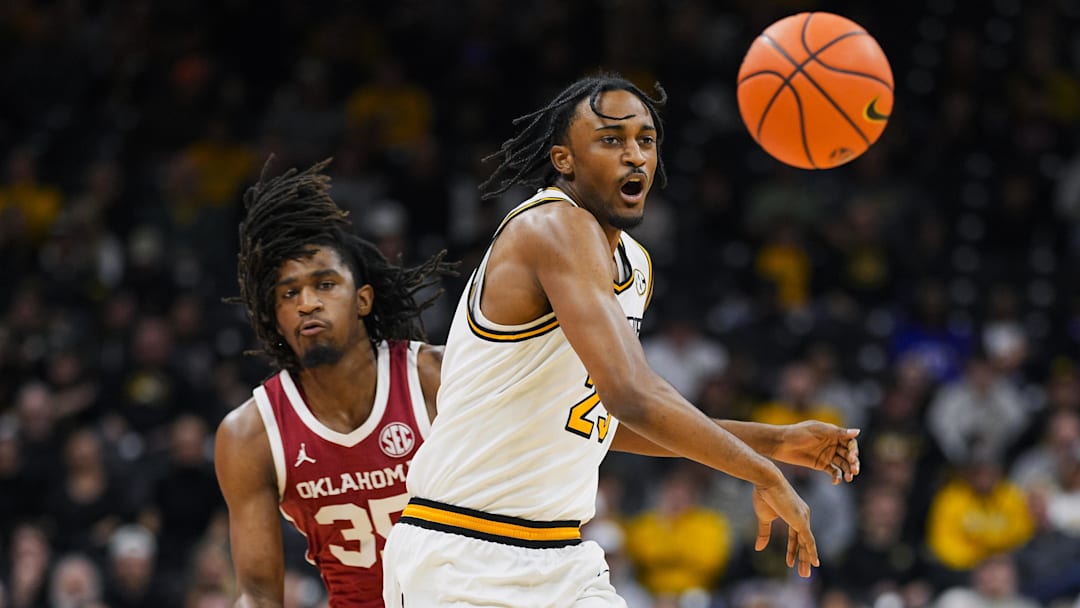 Feb 12, 2025; Columbia, Missouri, USA; Oklahoma Sooners forward Glenn Taylor Jr. (35) knocks the ball away from Missouri Tigers guard Aidan Shaw (23) during the first half at Mizzou Arena. Mandatory Credit: Jay Biggerstaff-Imagn Images