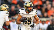 Purdue Boilermakers running back Devin Mockobee (45) runs the ball
