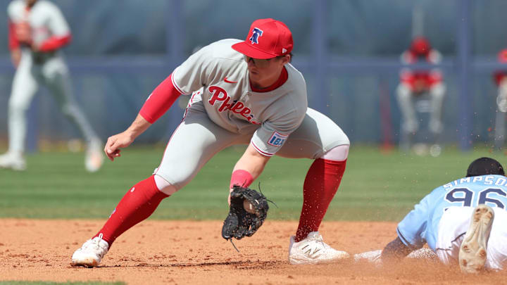 Feb 25, 2025; Port Charlotte, Florida, USA;  Tampa Bay Rays outfielder Chandler Simpson (96) slides safely into second base against Philadelphia Phillies infielder Aidan Miller (81) at Charlotte Sports Park.