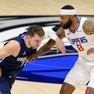 May 28, 2021; Dallas, Texas, USA; Dallas Mavericks guard Luka Doncic (77) and LA Clippers forward Marcus Morris Sr. (8) in action during game three between the Clippers and the Mavericks in the first round of the 2021 NBA Playoffs at American Airlines Center. Mandatory Credit: Jerome Miron-Imagn Images