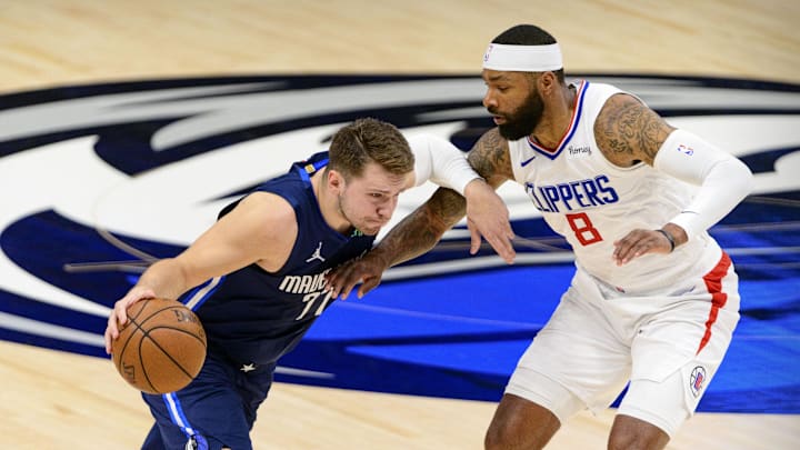 May 28, 2021; Dallas, Texas, USA; Dallas Mavericks guard Luka Doncic (77) and LA Clippers forward Marcus Morris Sr. (8) in action during game three between the Clippers and the Mavericks in the first round of the 2021 NBA Playoffs at American Airlines Center. Mandatory Credit: Jerome Miron-Imagn Images