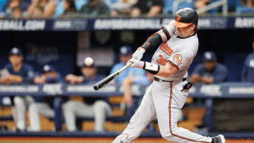 Jun 9, 2024; St. Petersburg, Florida, USA;  Baltimore Orioles catcher Adley Rutschman (35) hits an rbi single against the Tampa Bay Rays in the third inning at Tropicana Field. Mandatory Credit: Nathan Ray Seebeck-USA TODAY Sports