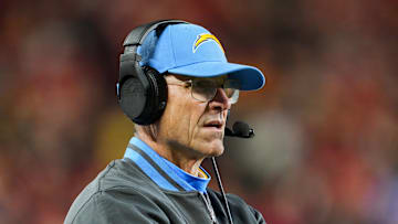Dec 8, 2024; Kansas City, Missouri, USA; Los Angeles Chargers head coach Jim Harbaugh watches from the sideline during the first half against the Kansas City Chiefs at GEHA Field at Arrowhead Stadium. Mandatory Credit: Jay Biggerstaff-Imagn Images