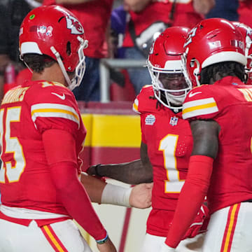 Sep 5, 2024; Kansas City, Missouri, USA; Kansas City Chiefs wide receiver Xavier Worthy (1) celebrates with quarterback Patrick Mahomes (15) and wide receiver Rashee Rice (4) after scoring a touchdown against the Baltimore Ravens during the game at GEHA Field at Arrowhead Stadium. Mandatory Credit: Denny Medley-Imagn Images