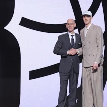 Jun 25, 2025; Brooklyn, NY, USA;  Egor Demin stands with NBA commissioner Adam Silver after being selected as the eighth pick by the Brooklyn Nets in the first round of the 2025 NBA Draft at Barclays Center. Mandatory Credit: Brad Penner-Imagn Images