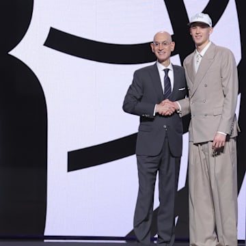 Jun 25, 2025; Brooklyn, NY, USA;  Egor Demin stands with NBA commissioner Adam Silver after being selected as the eighth pick by the Brooklyn Nets in the first round of the 2025 NBA Draft at Barclays Center. Mandatory Credit: Brad Penner-Imagn Images