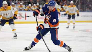 Mar 1, 2025; Elmont, New York, USA; New York Islanders center Brock Nelson (29) take a shot against the Nashville Predators during the second period at UBS Arena. Mandatory Credit: Thomas Salus-Imagn Images