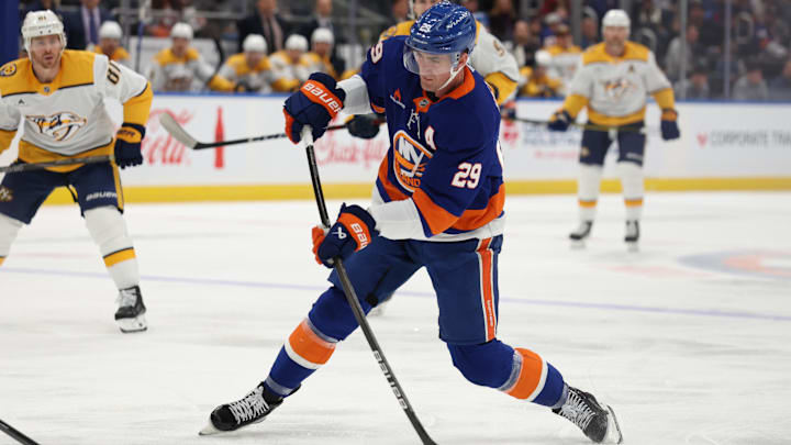 Mar 1, 2025; Elmont, New York, USA; New York Islanders center Brock Nelson (29) take a shot against the Nashville Predators during the second period at UBS Arena. Mandatory Credit: Thomas Salus-Imagn Images