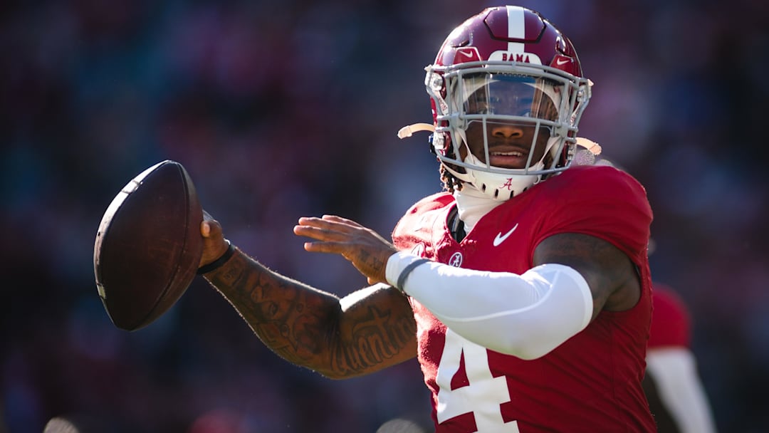 Nov 30, 2024; Tuscaloosa, Alabama, USA; Alabama Crimson Tide quarterback Jalen Milroe (4) warms up before a game against the Auburn Tigers at Bryant-Denny Stadium. Mandatory Credit: Will McLelland-Imagn Images