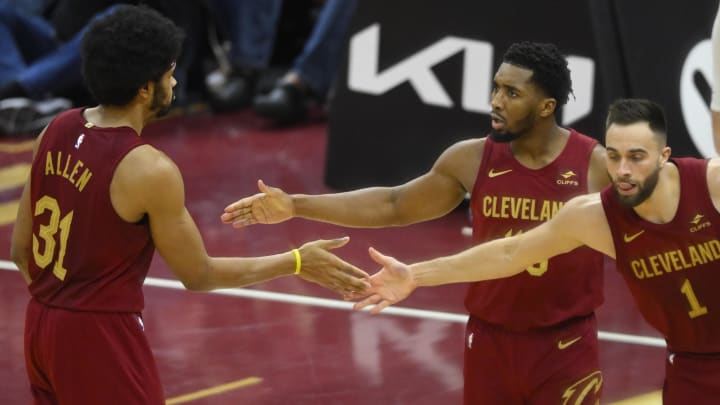 Jan 7, 2024; Cleveland, Ohio, USA; Cleveland Cavaliers center Jarrett Allen (31), guard Donovan Mitchell (45) and guard Max Strus (1) celebrate in the fourth quarter against the San Antonio Spurs at Rocket Mortgage FieldHouse. Mandatory Credit: David Richard-USA TODAY Sports