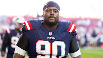 Dec 15, 2024; Glendale, Arizona, USA; New England Patriots defensive tackle Christian Barmore (90) against the Arizona Cardinals at State Farm Stadium. Mandatory Credit: Mark J. Rebilas-Imagn Images